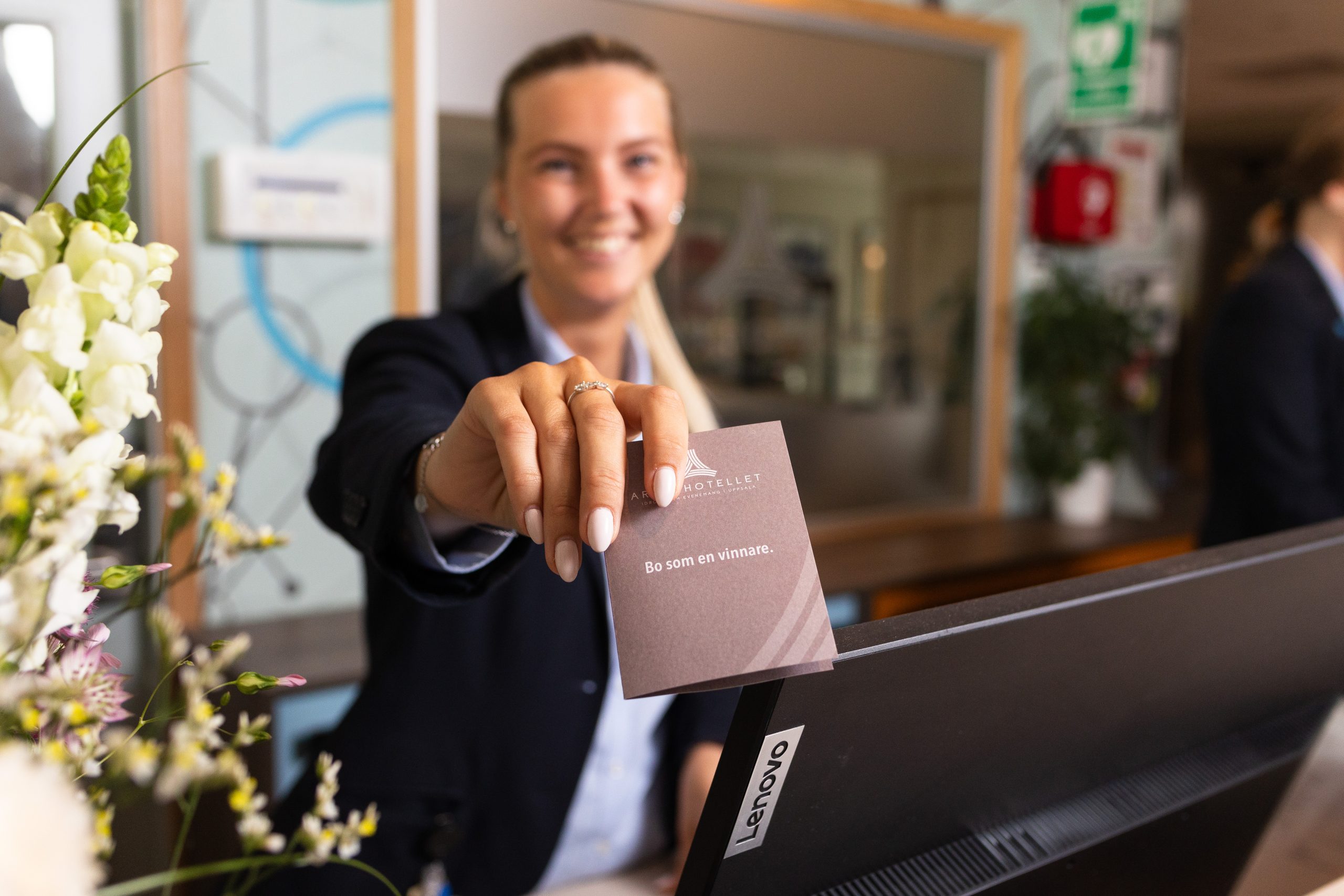 Receptionist handing over room key